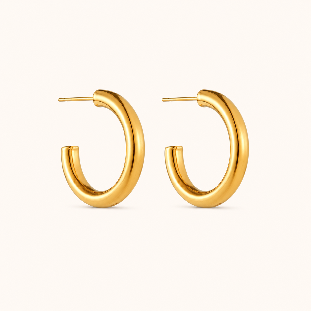 Gold hoop earrings on a white background